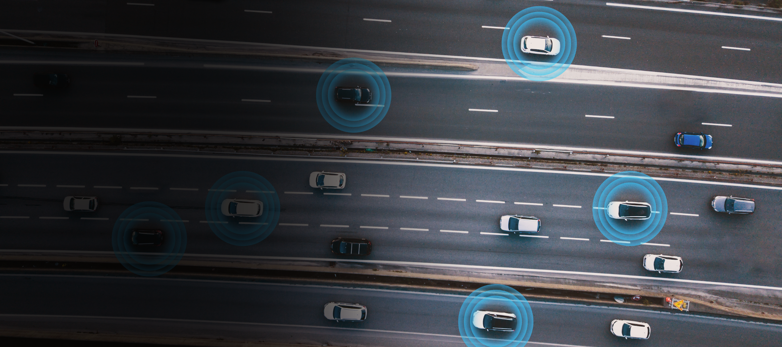 Cars on the road connected to the internet with blue signals showing their connectivity